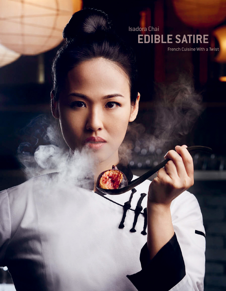 Book cover of Edible Satire: French Cuisine With a Twist, featuring head chef Isadora Chai. Published by Images Publishing.