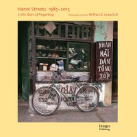 Book cover of Hanoi Streets 1985-2015: In the Years of Forgetting, with a push bike leaning against a shop in Vietnam. Published by Images Publishing.