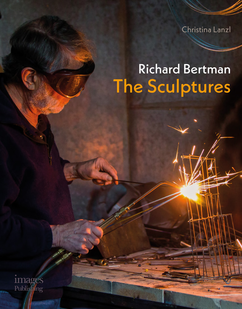 Sculptor Richard Bertman in goggles, welding metal wires together, in studio, Richard Bertman The Sculptures in white and orange font to upper right.