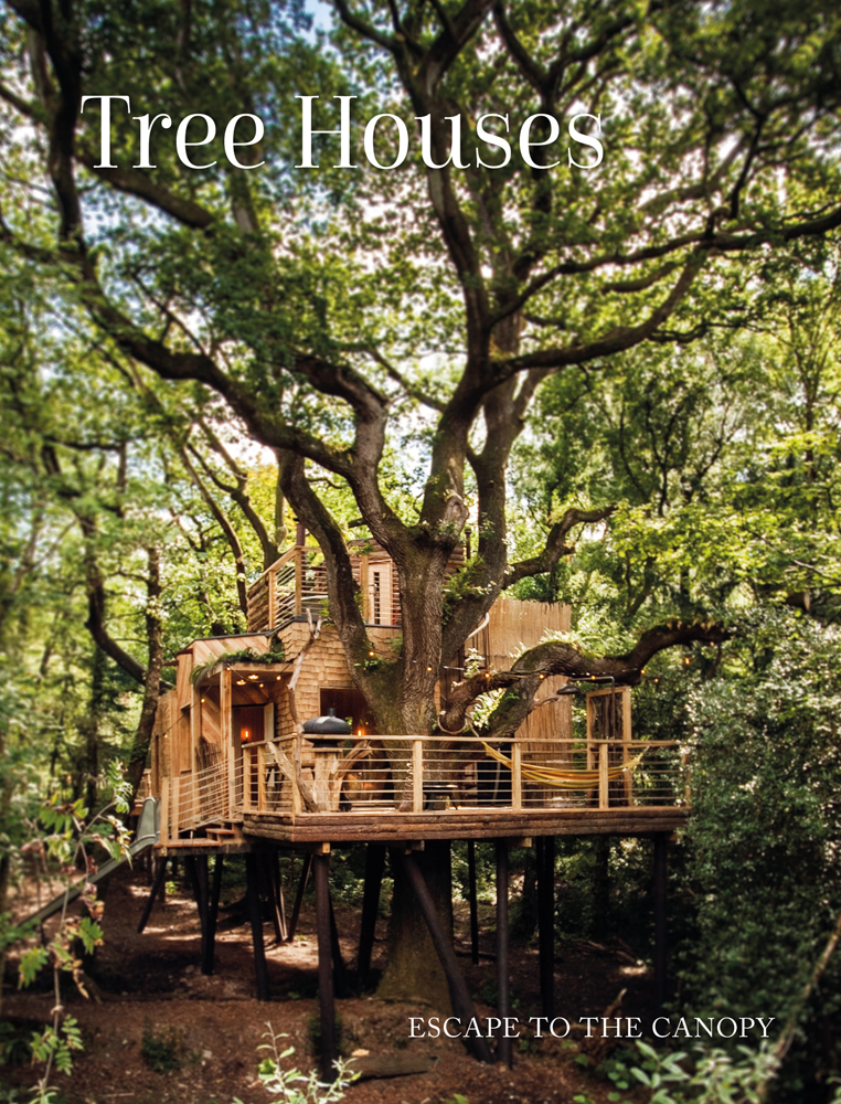 Large low wooden tree house with balcony on stilts, build around forest tree with Tree Houses in white font above
