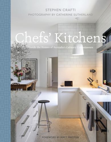 Cool white interior kitchen with marble worktop, knife block, on cover of 'Chefs' Kitchens, Inside the Homes of Australia's Culinary Connoisseurs', by Images Publishing.