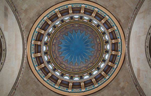Book cover of An American Renaissance: Beaux-Arts Architecture in New York City, with low angled shot of interior ceiling dome with white and gold plaster. Published by Images Publishing.