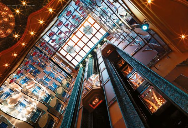 Book cover of Design on the High Seas: Setting the Scene for Entertainment Architecture Aboard Cruise Ships, featuring a grand theatre interior with stage area. Published by Images Publishing.