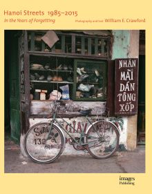 Book cover of Hanoi Streets 1985-2015: In the Years of Forgetting, with a push bike leaning against a shop in Vietnam. Published by Images Publishing.