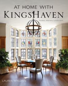 Book cover of At Home with KingsHaven: Estates, Interiors, Landscapes, featuring a light interior space with wood floor, and table and chairs in front of large stained glass window. Published by Images Publishing.