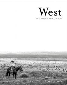 Cowboy on horseback to lower left of vast American landscape, West THE AMERICAN COWBOY in black and grey font to upper right.