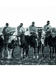 Book cover of West, The American Cowboy, featuring a cowboy on horseback on vast American landscape. Published by Images Publishing.