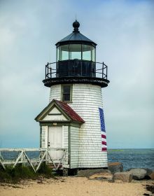 Blue cover with orange silhouette of grass, NANTUCKET Classic American style 30 miles out to sea in white font above.