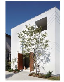 Book cover of The Intimate Beauty of a Japanese Courtyard, with a courtyard at dusk with view into warm interior living space. Published by Images Publishing.