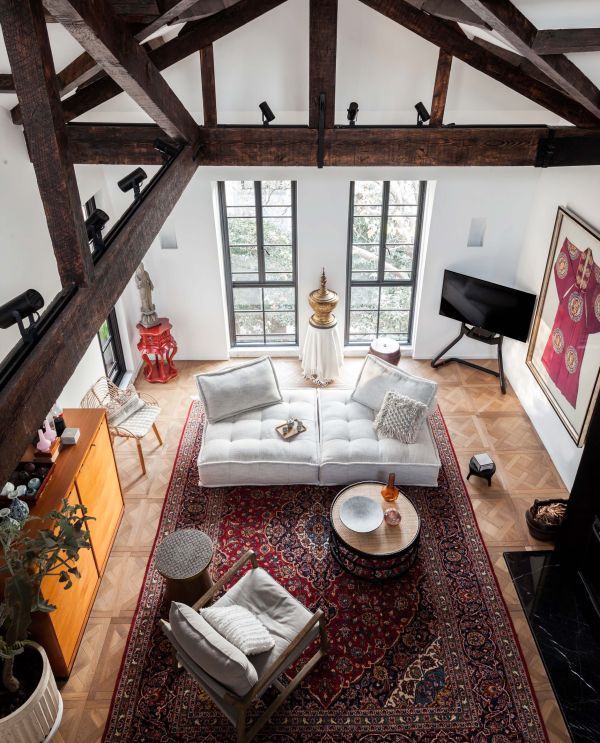 Book cover of Residences Reimagined: Successful Renovation and Expansion of Old Homes, featuring an interior room with exposed brickwork, beamed ceiling, and an armchair on white tiled floor. Published by Images Publishing.