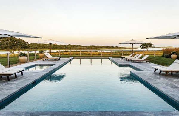 Book cover of Intersection of Nature and Art: James Doyle Design Associates, featuring a landscaped garden with topiary hedge and sculpture of face. Published by Images Publishing.