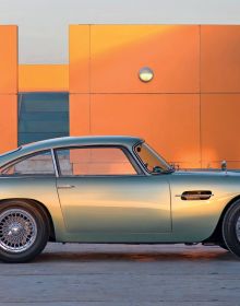 Book cover of Aston Martin: The DB Label: From the DB2 to the DBX, featuring an orange Aston Martin Virage Coupé, with mountain-scape behind. Published by Images Publishing.