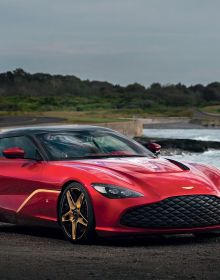 Book cover of Aston Martin: The DB Label: From the DB2 to the DBX, featuring an orange Aston Martin Virage Coupé, with mountain-scape behind. Published by Images Publishing.