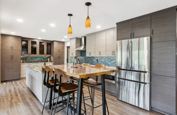 Book cover of Kitchen Conversations: Sharing Secrets to Kitchen Design Success, with the interior of clean, white kitchen with tiled floor and large oven. Published by Images Publishing.