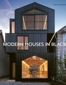 Book cover of Susan Redman's Modern Homes in Black, with a black wooden lake house in Berlin, surrounded by a garden. Published by Images Publishing.