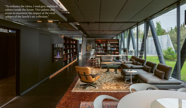 Book cover of Susan Redman's Modern Homes in Black, with a black wooden lake house in Berlin, surrounded by a garden. Published by Images Publishing.