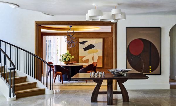 Book cover of Tailored Interiors: The Bespoke Designs of Patrick Sutton; featuring a circular interior with a spiral staircase and curved bench. Published by Images Publishing.