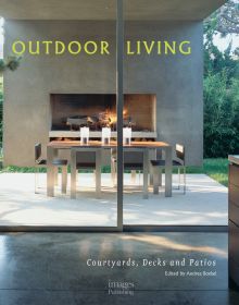 Book cover of Outdoor Living: Courtyards, Decks and Patios featuring a garden patio area with fireplace, table and chairs, and oven. Published by Images Publishing.