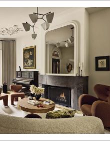 Book cover of Stories of Home: Residential Designs by Hacin; showcasing a modern living room with a fireplace, contemporary lighting, and warm-toned furnishings. Published by Images Publishing.