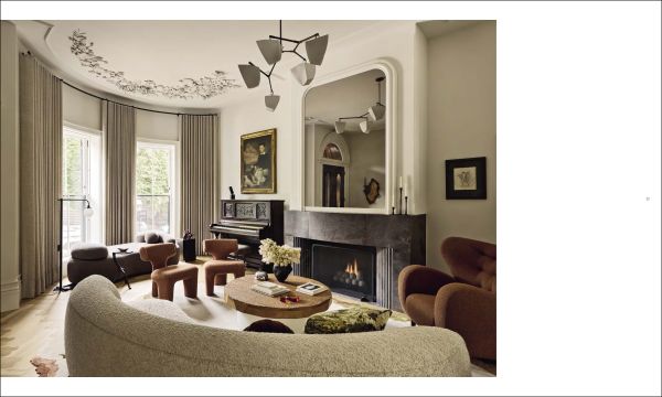 Book cover of Stories of Home: Residential Designs by Hacin; showcasing a modern living room with a fireplace, contemporary lighting, and warm-toned furnishings. Published by Images Publishing.