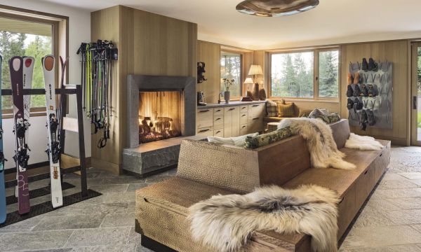Book cover of Stories of Home: Residential Designs by Hacin; showcasing a modern living room with a fireplace, contemporary lighting, and warm-toned furnishings. Published by Images Publishing.